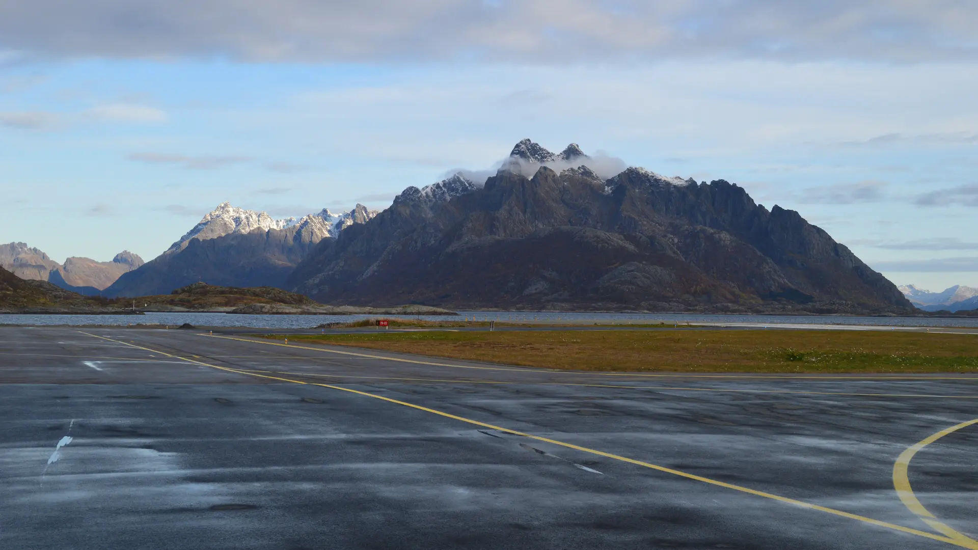 Runway at Svolvær Airport with surrounding mountains in the Lofoten Islands, Norway.